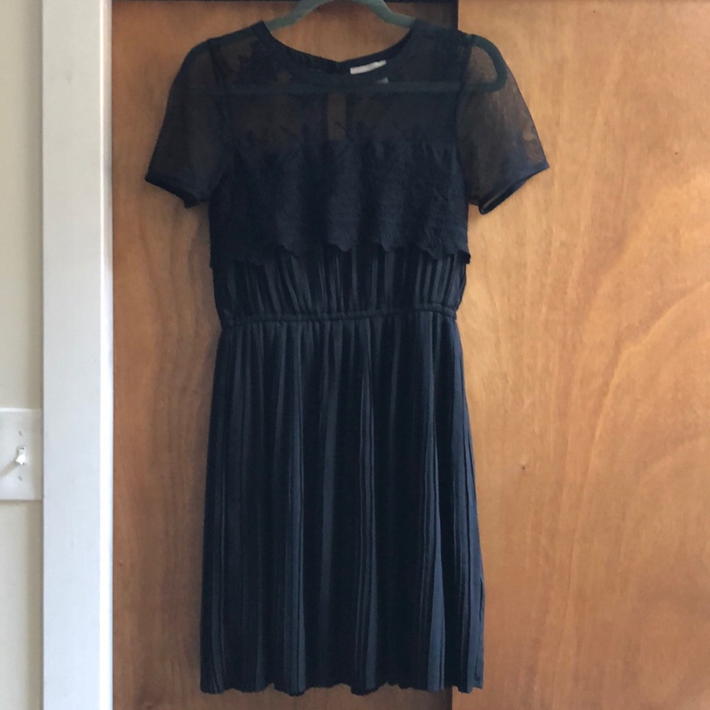 Black pleated lace dress.
